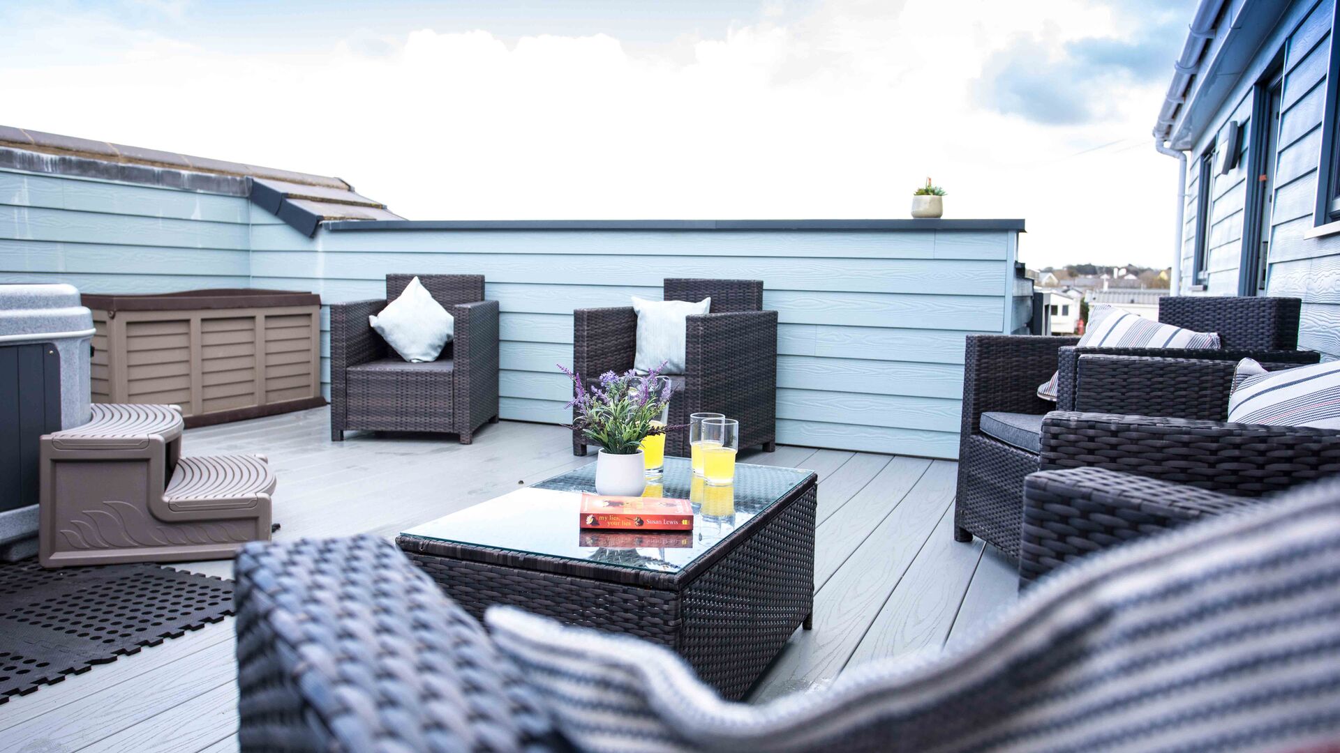 seating on the balcony at the Breakwater Apartment