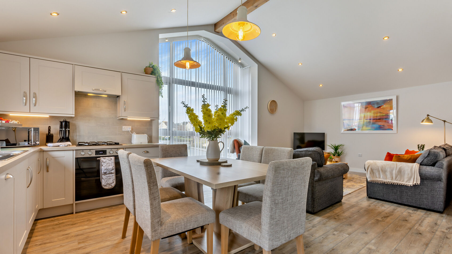 open plan living space with sea views at the Breakwater Apartment