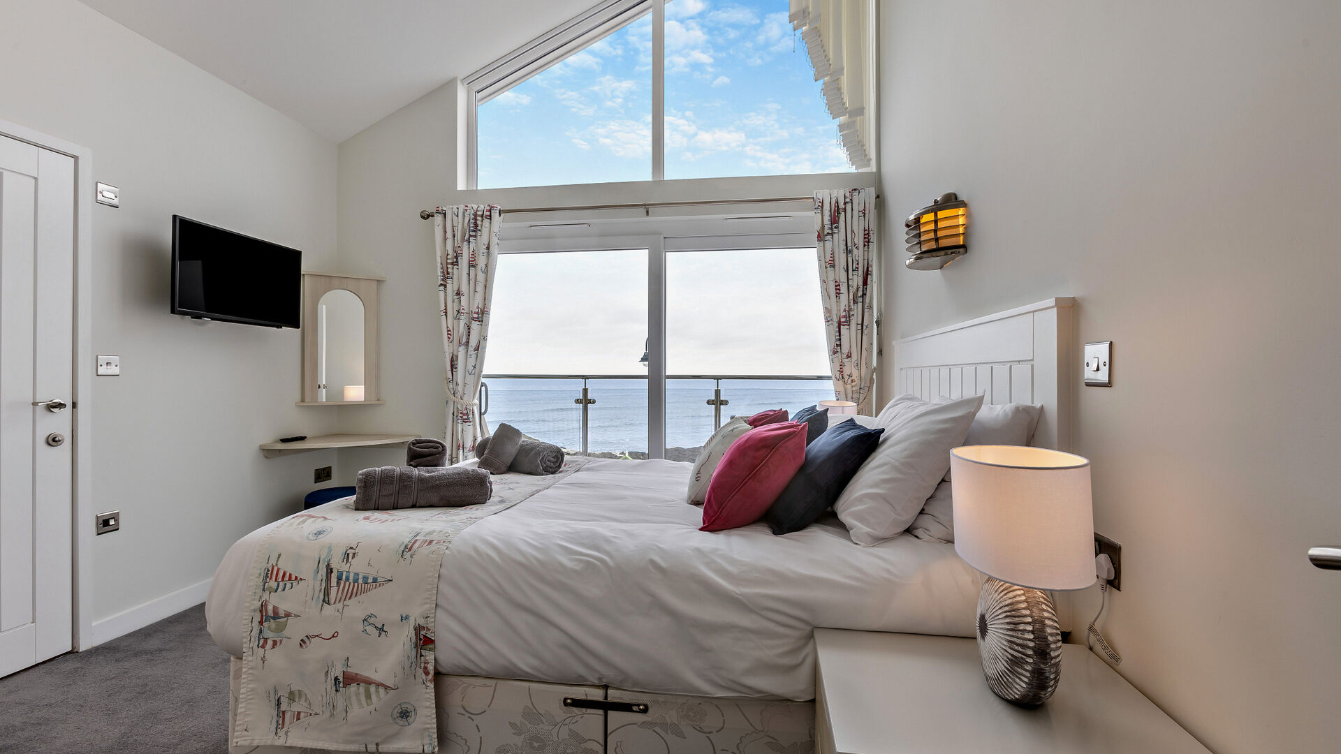 luxury double bedroom with sea views at the waterfront apartment westward ho